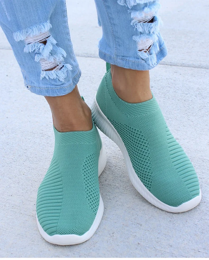 Ultra-comfortable casual slip-on summer sneakers in various colours, featuring a stretch fabric upper, rubber outsole, and cotton lining for a relaxed, breathable fit.