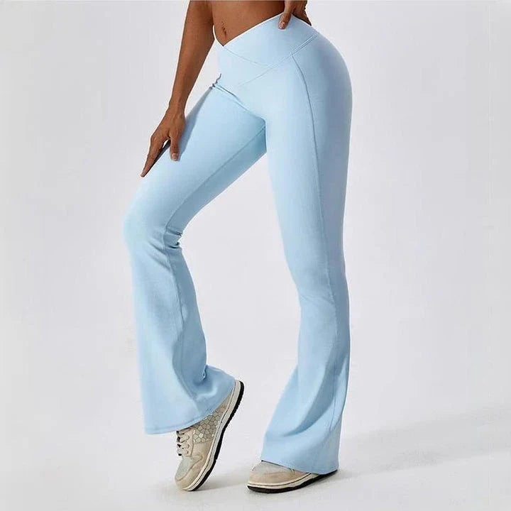 A pair of high-waisted, cross-waist yoga flare leggings in sky blue colour, perfect for yoga, fitness, and active adventures.