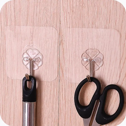 A set of 12 transparent wall hangers that can hold a variety of household items in the bathroom, kitchen, and other rooms