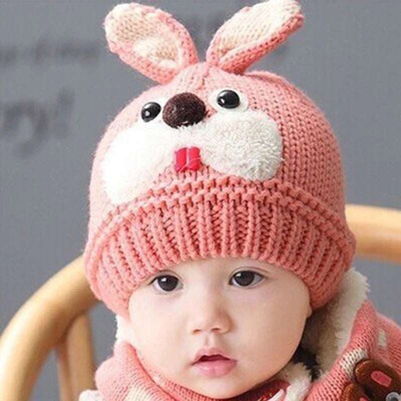 A soft, premium woolen hat for babies with a charming cartoon pattern, keeping them warm and cozy during cold weather.