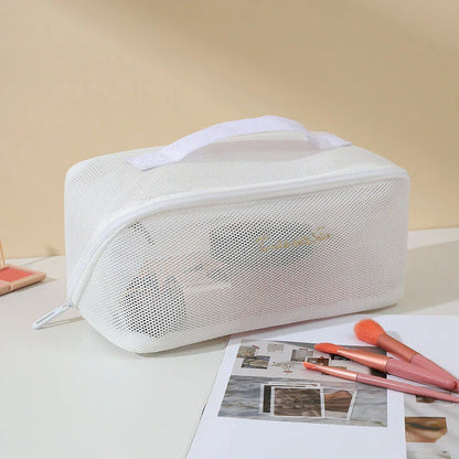 Trendha Clear Mesh Travel Cosmetic Organizer in pink and white colors, with transparent design and zipper closure