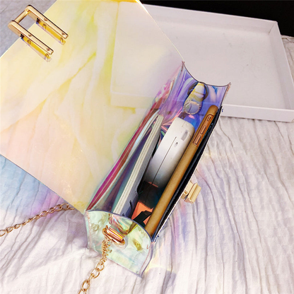 GEONYIEEK transparent modern coloured handbag in silver, pink, and blue shades with adjustable gold chain strap