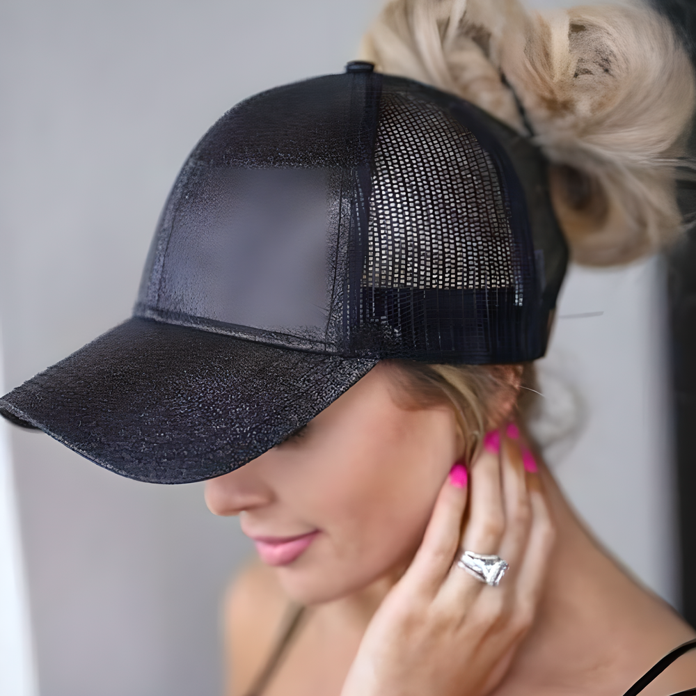 Women's mesh ponytail cap in various glitter and plain colours, featuring a sun visor and breathable design for comfort and style.