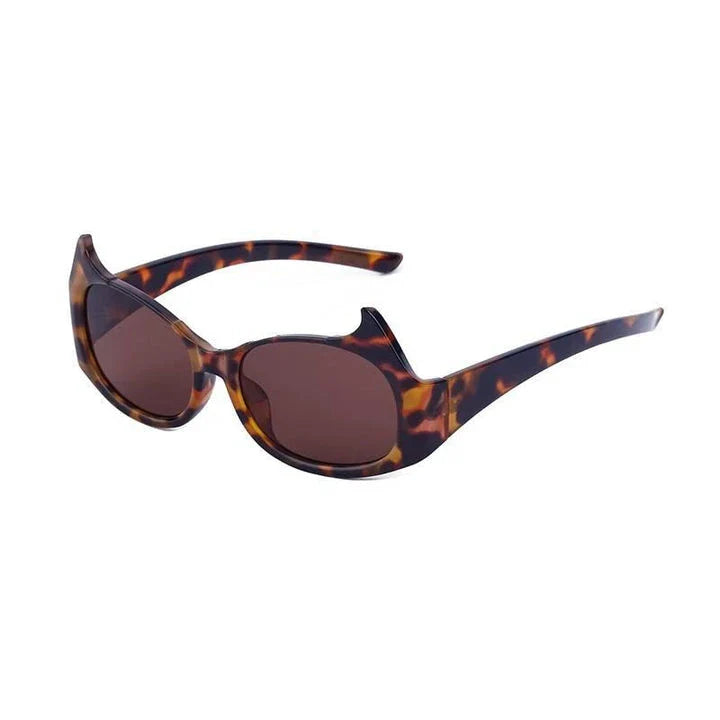 Stylish cat-eye luxury sunglasses with oversized frames and semi-rimless design in a leopard gray color