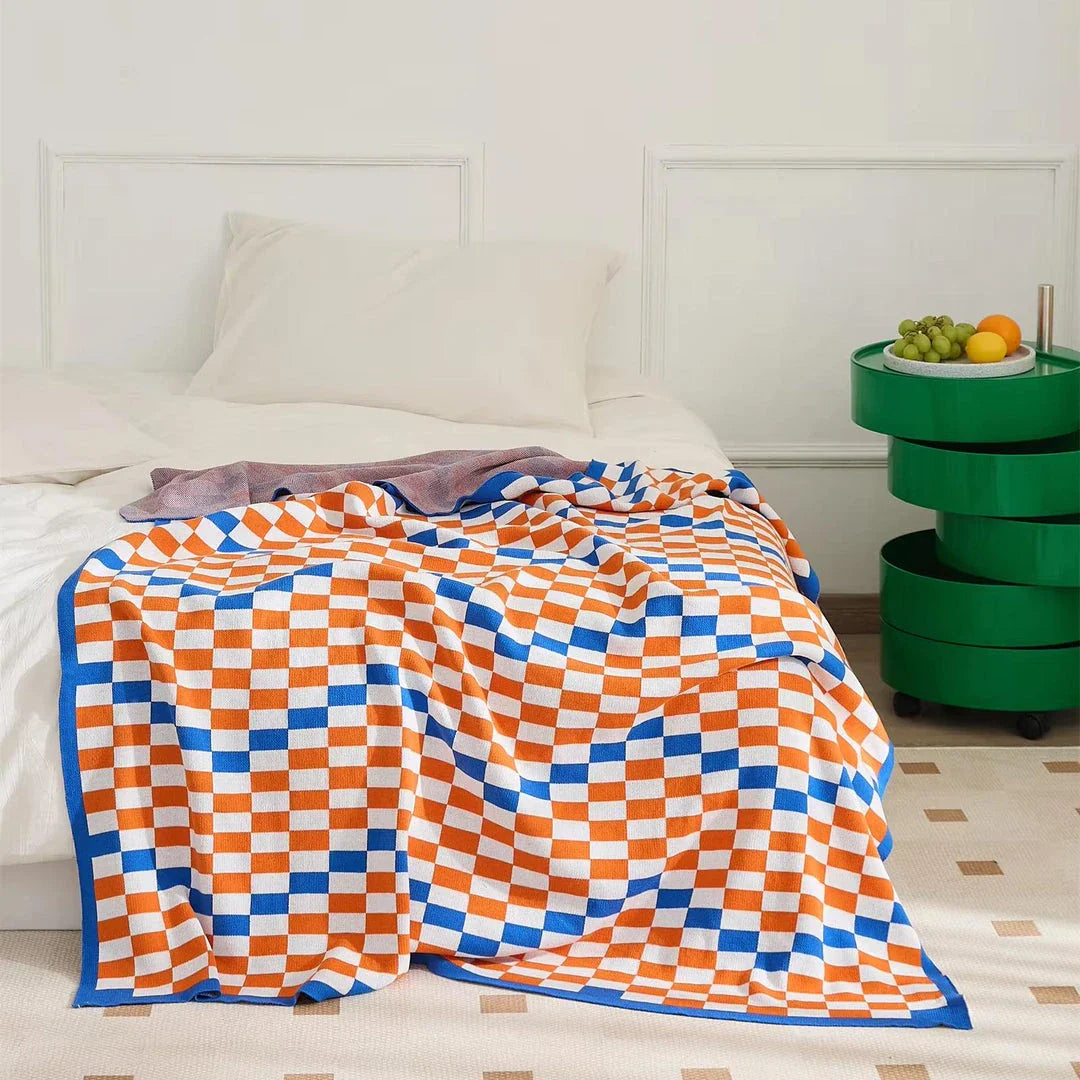 Cozy Kiwi Plaid Blanket in blue, perfect for home, travel, and outdoor use with its soft cotton construction and vibrant design