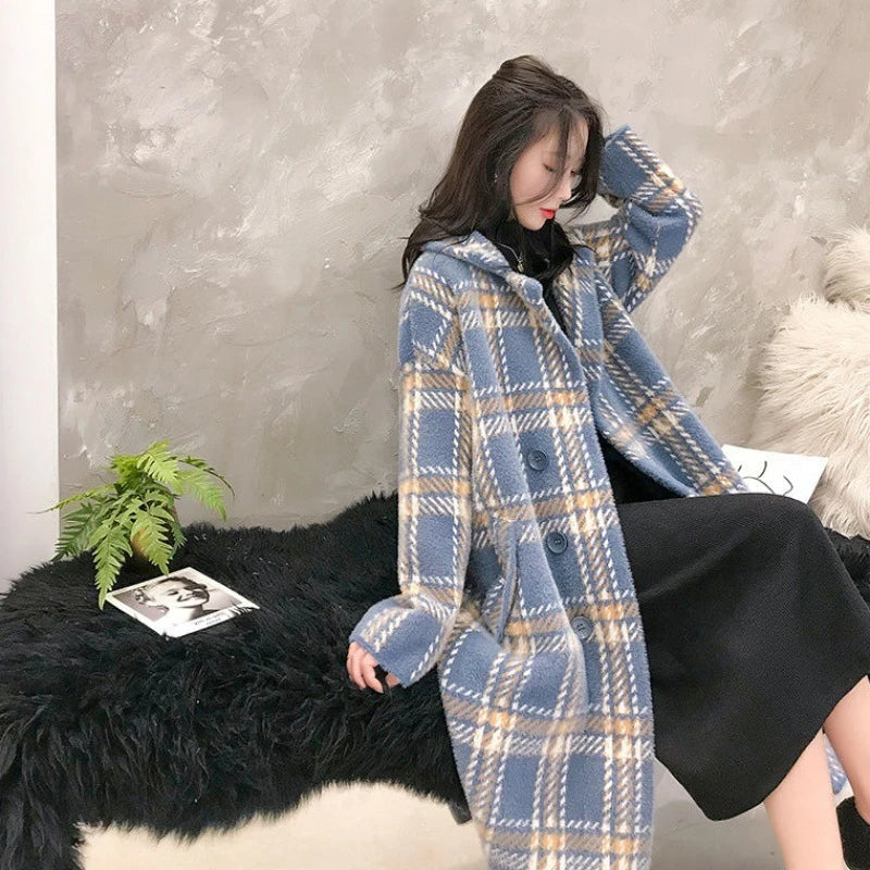 A cosy, plaid jumper coat made from a luxurious blend of mink hair and acrylic for maximum warmth and style.