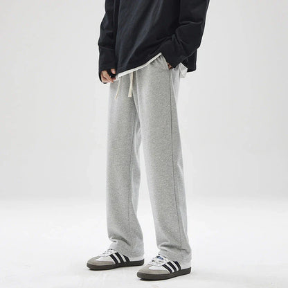 Straight gray sweatpants with a chic draping effect, perfect for Kiwi casual fashion