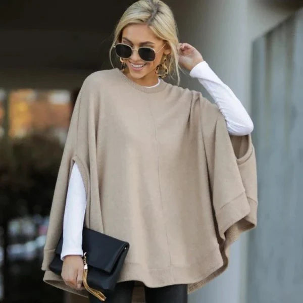 Cosy and relaxed bat-sleeve knit top poncho in a classic plain design, perfect for everyday Kiwi style