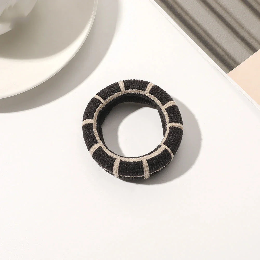 Stylish knitted lattice hair scrunchies in a black and white striped pattern, perfect for Kiwi women's hair accessories