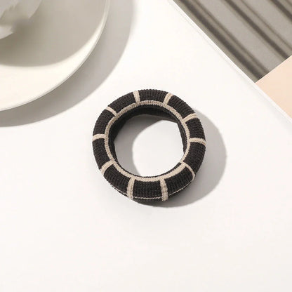 Stylish knitted lattice hair scrunchies in a black and white striped pattern, perfect for Kiwi women's hair accessories