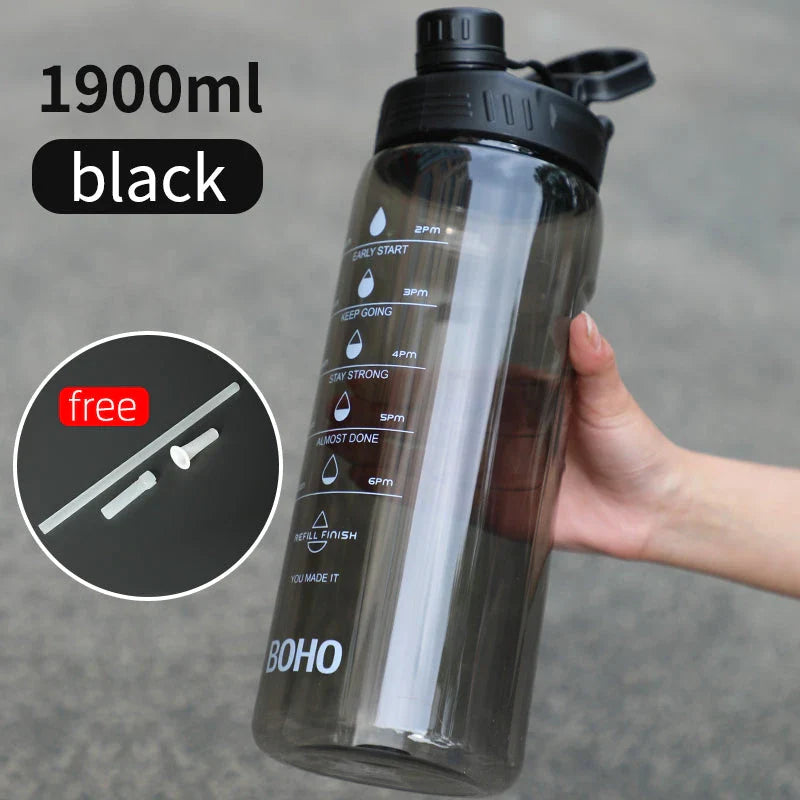 2 liter water bottle with straw, durable Tritan plastic construction, leak-proof design, time scale markings for hydration tracking