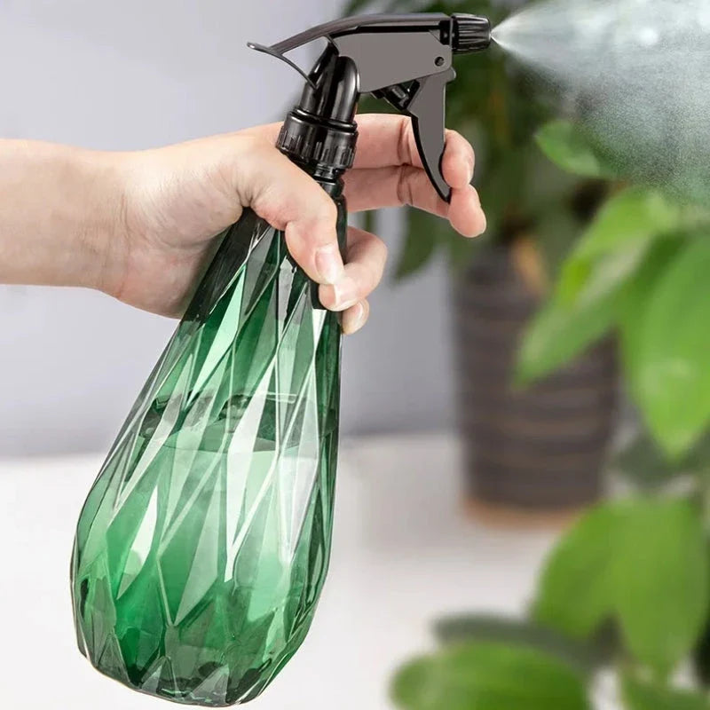 A sleek, 1000ml diamond-patterned watering can with a transparent body for easy water level monitoring