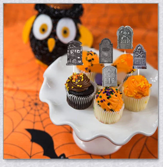 Spooky tombstone-themed cupcake toppers with skeleton designs, perfect for Kiwi Halloween parties and events