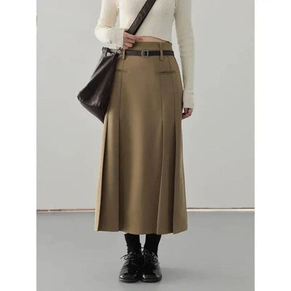 Elegant high-waisted pleated a-line skirt in a classic solid color for versatile wear throughout the autumn and winter seasons.