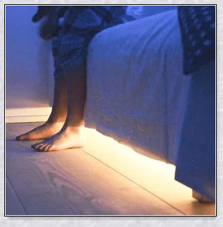 Cosy under-bed motion-activated LED light strip provides soft, guiding illumination in the dark