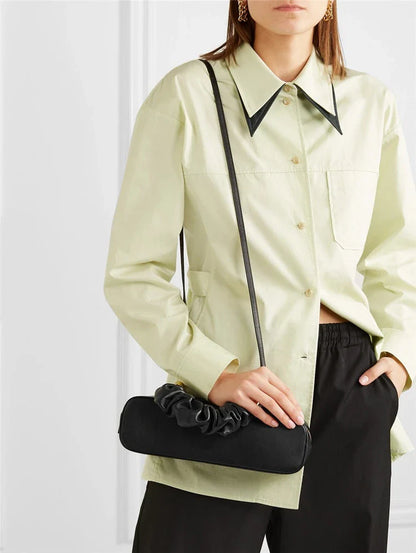 Stylish and versatile dark green shoulder bag with a long diagonal strap, perfect for everyday use in New Zealand.