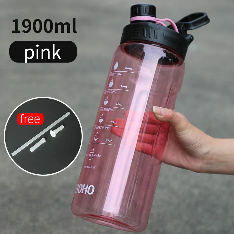 2 liter water bottle with straw, durable Tritan plastic construction, leak-proof design, time scale markings for hydration tracking