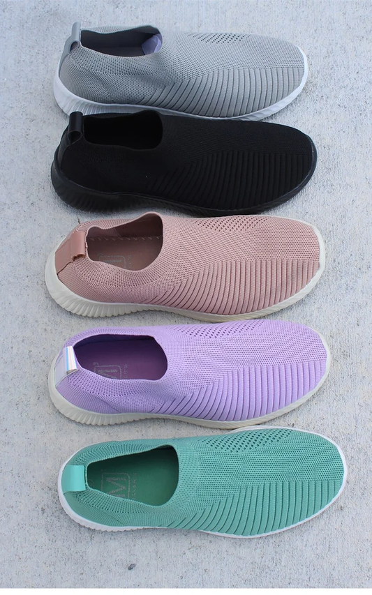 Ultra-comfortable casual slip-on summer sneakers in various colours, featuring a stretch fabric upper, rubber outsole, and cotton lining for a relaxed, breathable fit.