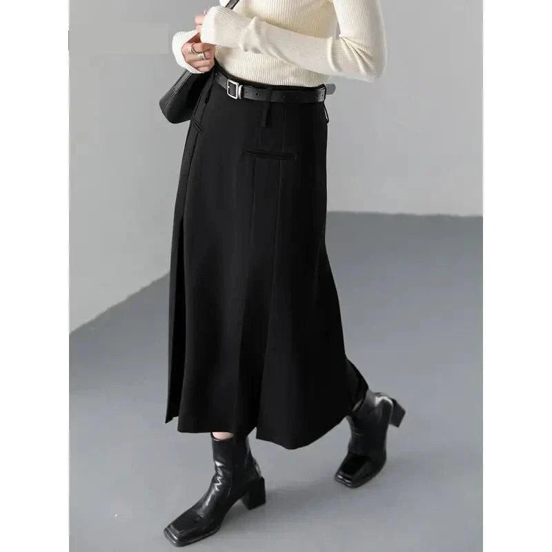 Elegant high-waisted pleated a-line skirt in a classic solid color for versatile wear throughout the autumn and winter seasons.