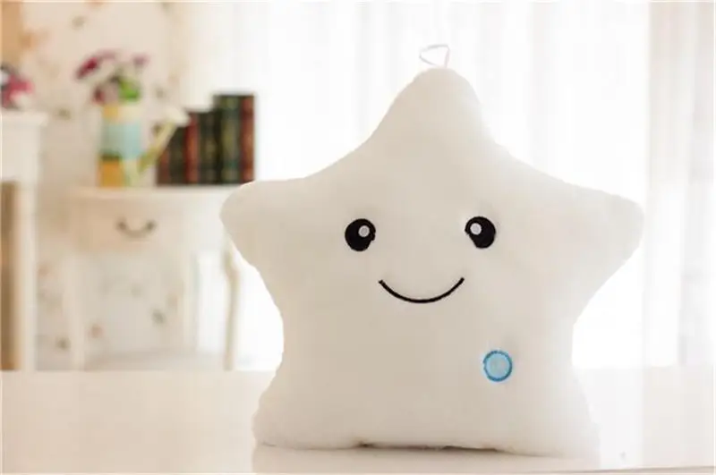 Soft, glowing plush pillow in the shape of a star, perfect for cuddling and providing a soothing nightlight for Kiwi kids