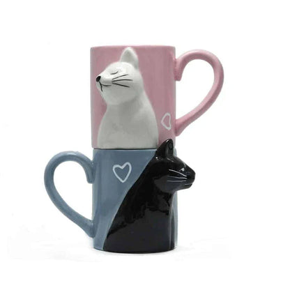 Two ceramic mugs with a playful design of two cats kissing, perfect for Kiwi cat lovers and couples