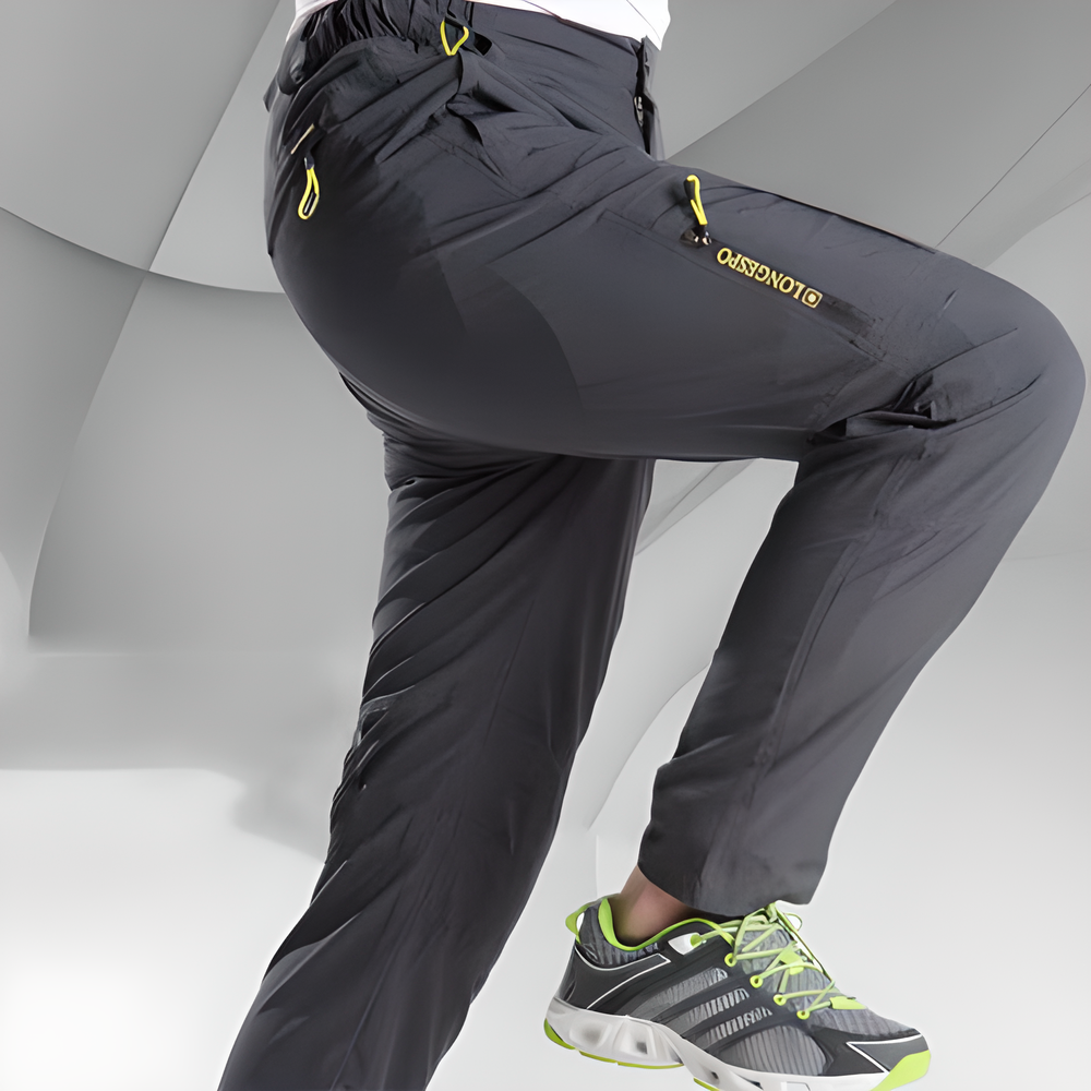 Durable stretch cargo pants for men with multiple pockets and reinforced stitching, ideal for outdoor adventures