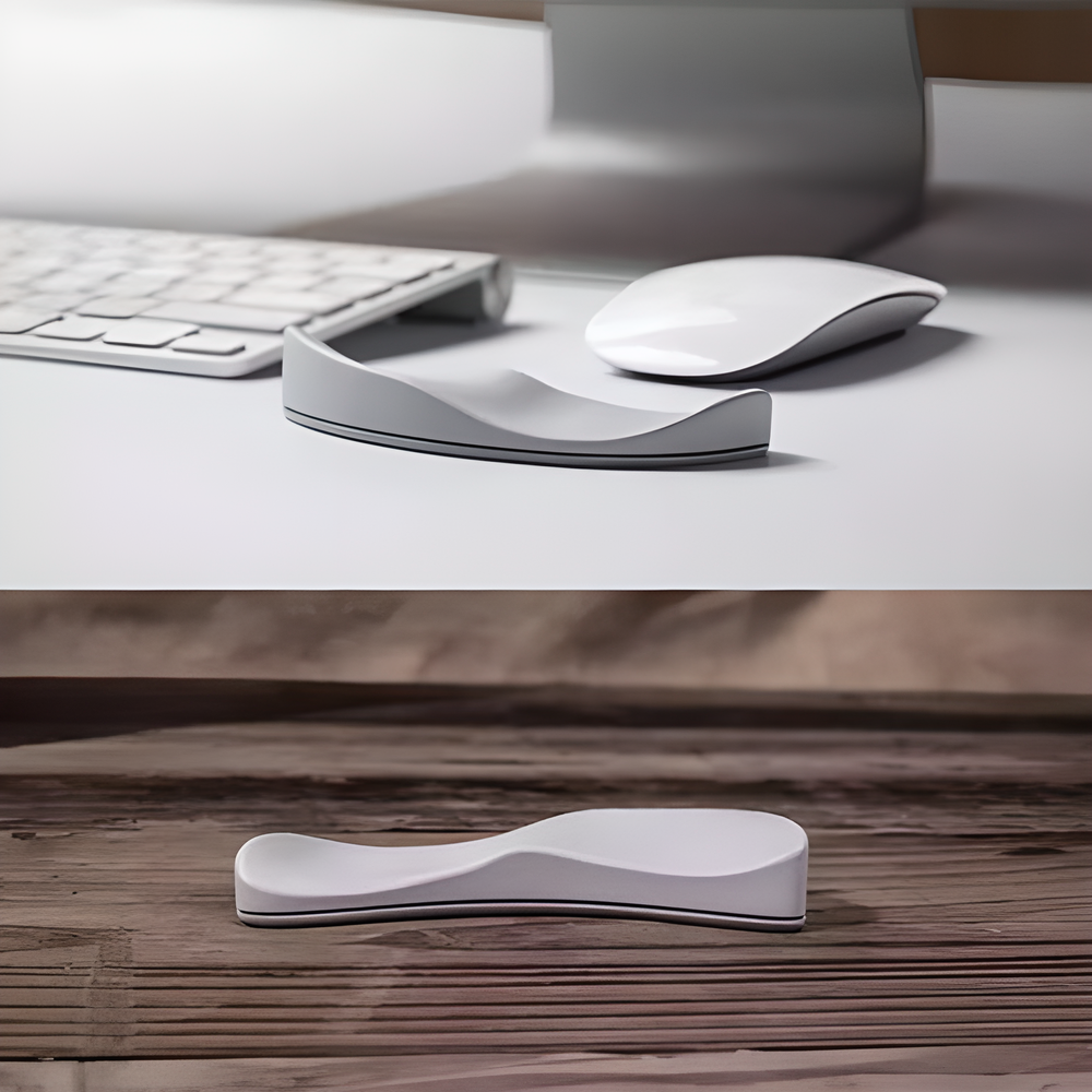 A white ergonomic wrist support pillow with silicon material on a modern desk, designed to provide comfort and natural alignment for computer users.