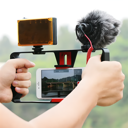 Smartphone video rig with accessories like LED light and microphone, providing stable and professional-grade filming capabilities