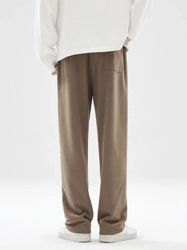 Straight gray sweatpants with a chic draping effect, perfect for Kiwi casual fashion