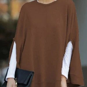 Cosy and relaxed bat-sleeve knit top poncho in a classic plain design, perfect for everyday Kiwi style