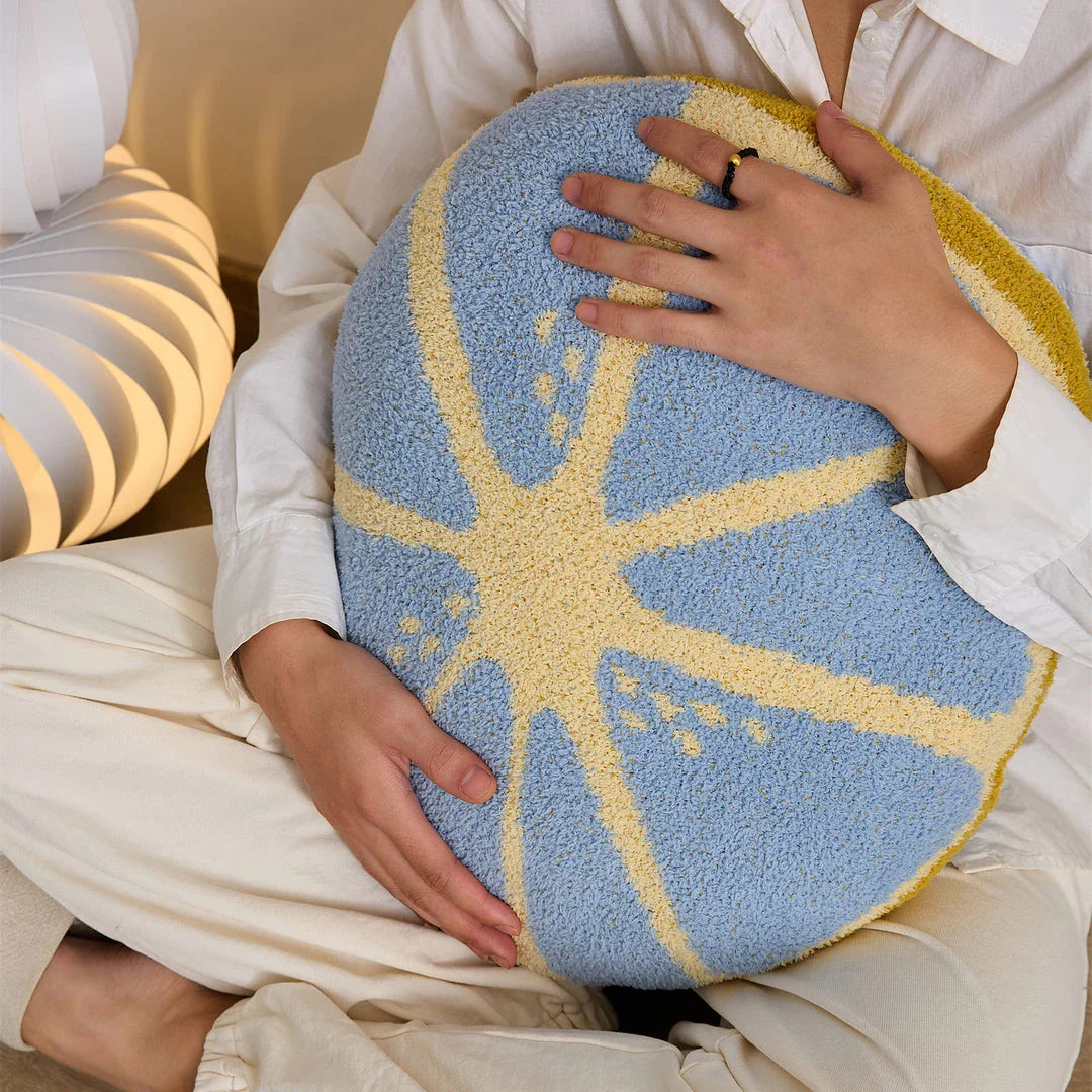 A vibrant, lemon-themed throw pillow with a crocheted pattern and soft, comfortable microfiber fabric.