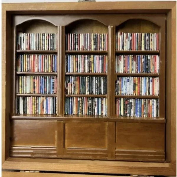 Compact wooden bookshelf toy with paper 'books' for anxiety relief and mindfulness, made in New Zealand