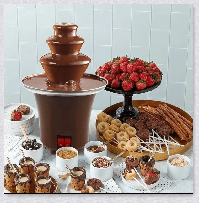 A 3-tier chocolate fondue fountain creating a mesmerizing chocolate waterfall, perfect for dipping a variety of sweet treats.