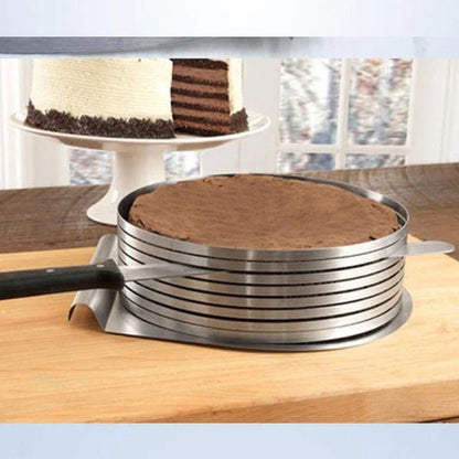 An adjustable stainless steel cake slicer with a ring that can be expanded or shrunk to fit cakes of different sizes, up to 12 inches in diameter.