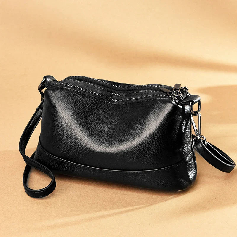 Premium cowhide shoulder bag in a variety of colors, featuring a stylish urban-inspired design, roomy main compartment, and adjustable strap for Kiwi women.