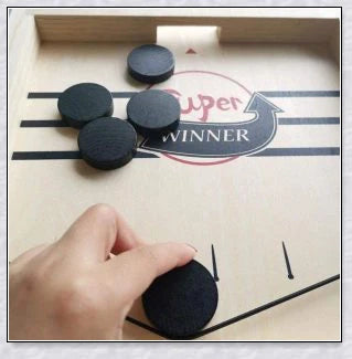 A hand-crafted wooden hockey game with rubber band-powered pucks, perfect for family bonding and screen-free fun in New Zealand