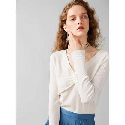 A stylish V-Neck jumper in dark grey, featuring a unique criss-cross design and a flattering slim fit for the modern Kiwi woman.