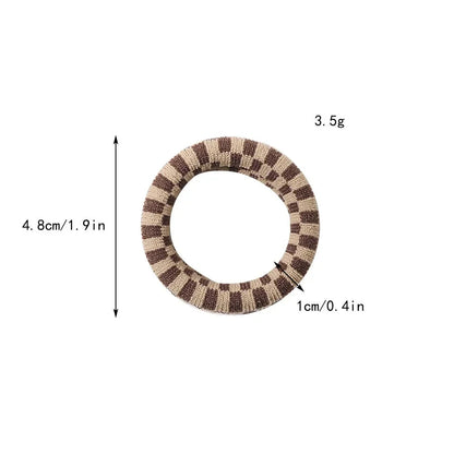 Stylish knitted lattice hair scrunchies in a black and white striped pattern, perfect for Kiwi women's hair accessories