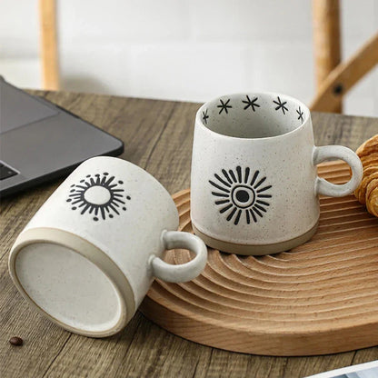 Handcrafted Japanese-inspired ceramic coffee mug with unique floral or sun design