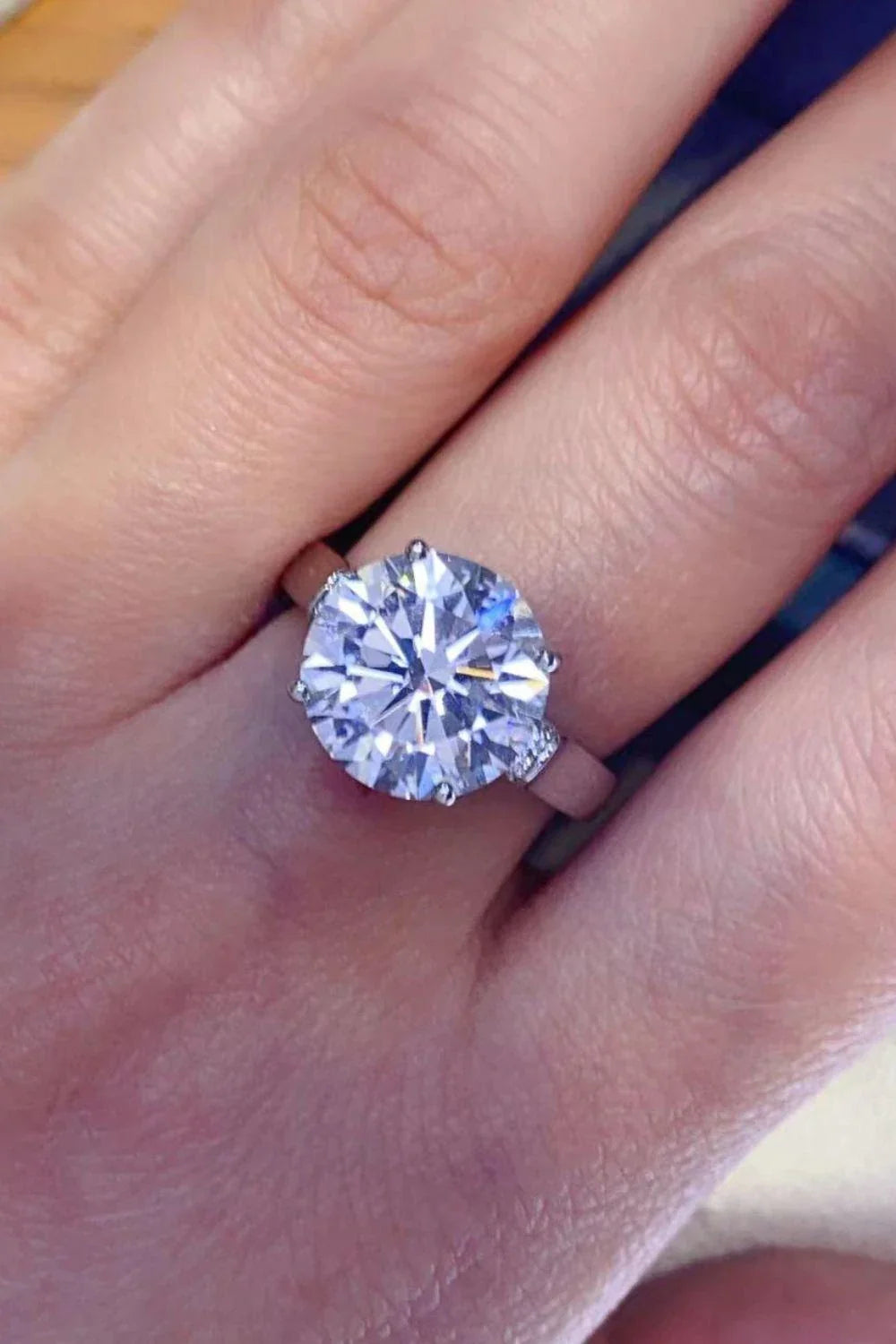 Elegant 5-Carat Moissanite Ring in Platinum Plating with a minimalist design and sparkling zircon accent stones