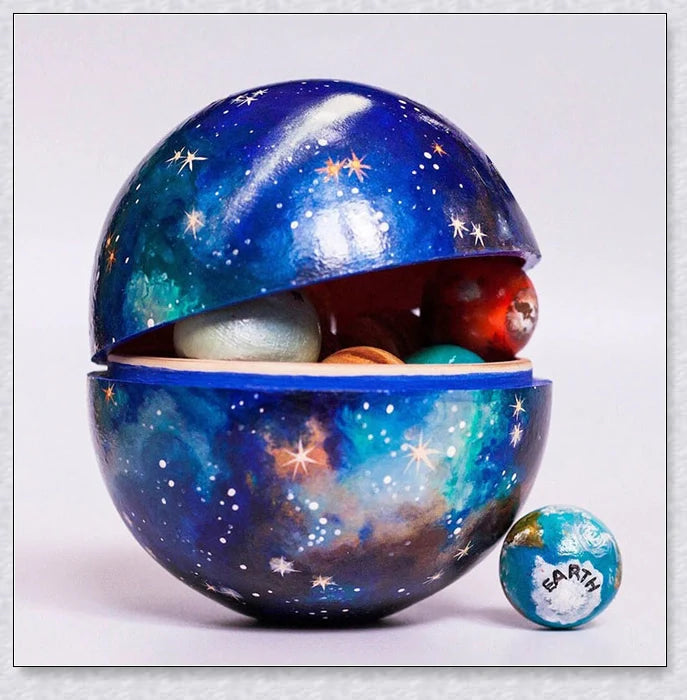 Wooden Solar System Learning Toy with hand-painted planets, sun, moon, rocket, and astronaut figures