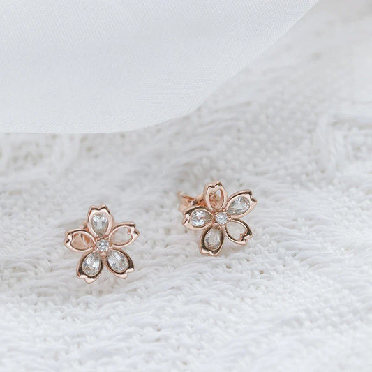 Handcrafted zircon cherry blossom earrings with a delicate floral design and 14k gold setting