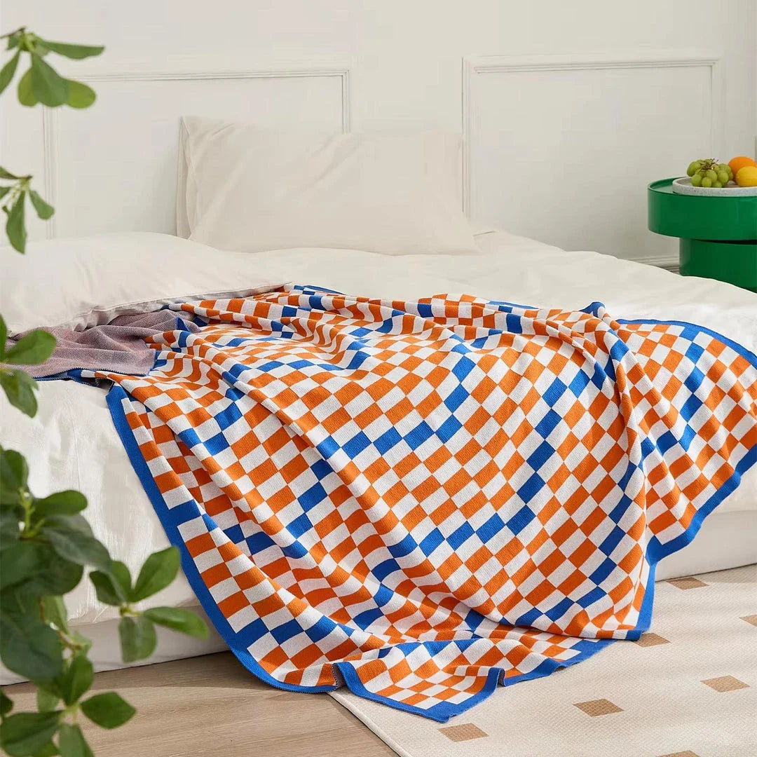 Cozy Kiwi Plaid Blanket in blue, perfect for home, travel, and outdoor use with its soft cotton construction and vibrant design