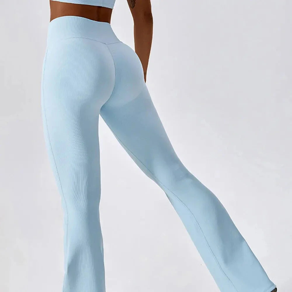 A pair of high-waisted, cross-waist yoga flare leggings in sky blue colour, perfect for yoga, fitness, and active adventures.