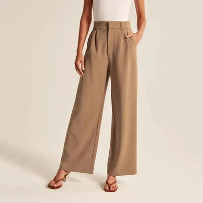 Elegant high-waisted wide-leg trousers in a gray-blue color, perfect for the modern woman's wardrobe.