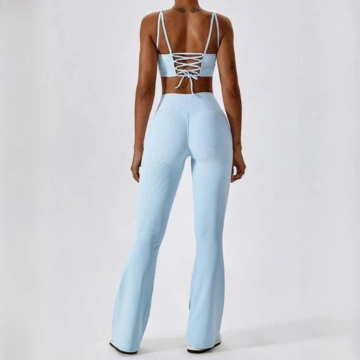 A pair of high-waisted, cross-waist yoga flare leggings in sky blue colour, perfect for yoga, fitness, and active adventures.