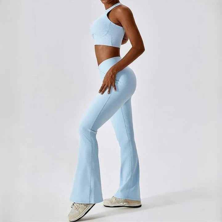 A pair of high-waisted, cross-waist yoga flare leggings in sky blue colour, perfect for yoga, fitness, and active adventures.