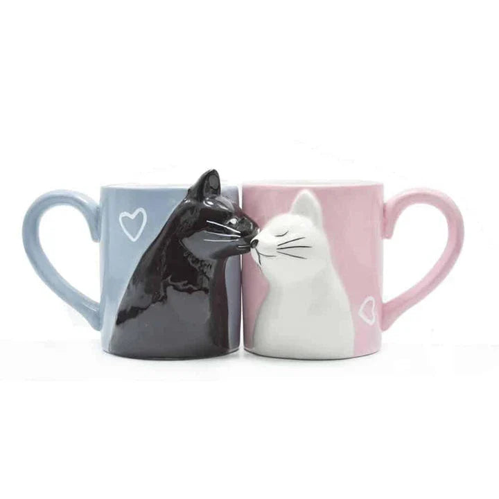 Two ceramic mugs with a playful design of two cats kissing, perfect for Kiwi cat lovers and couples