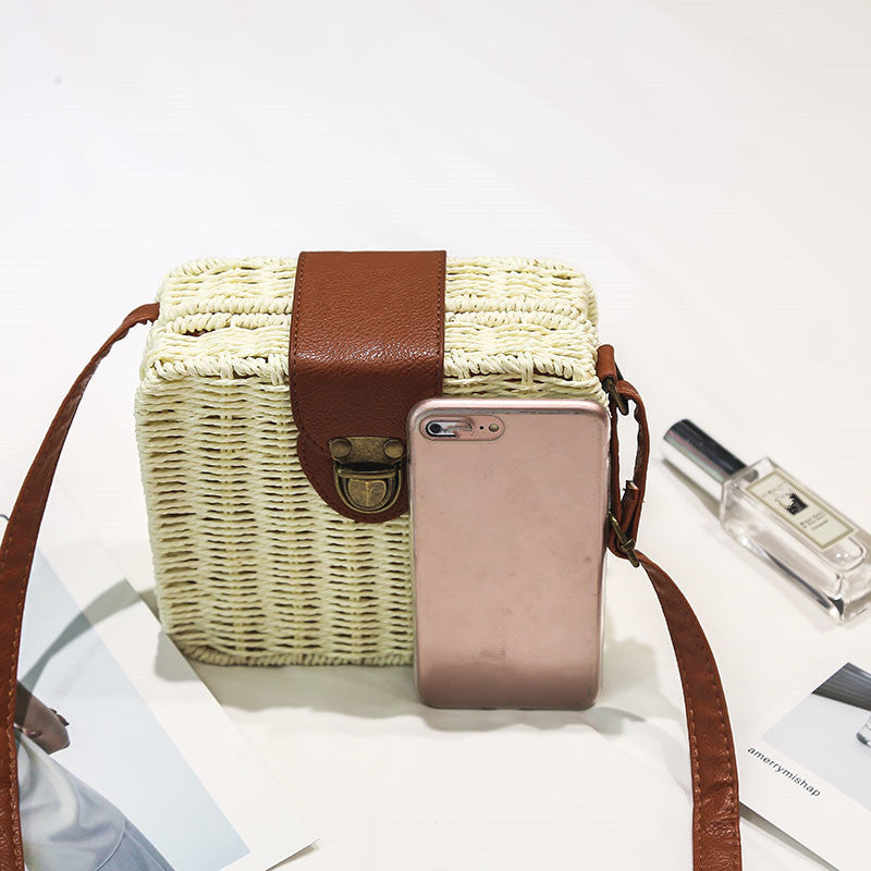 A collection of hand-woven tropical straw purses in various shapes, sizes, and designs, perfect for Kiwi summer style.