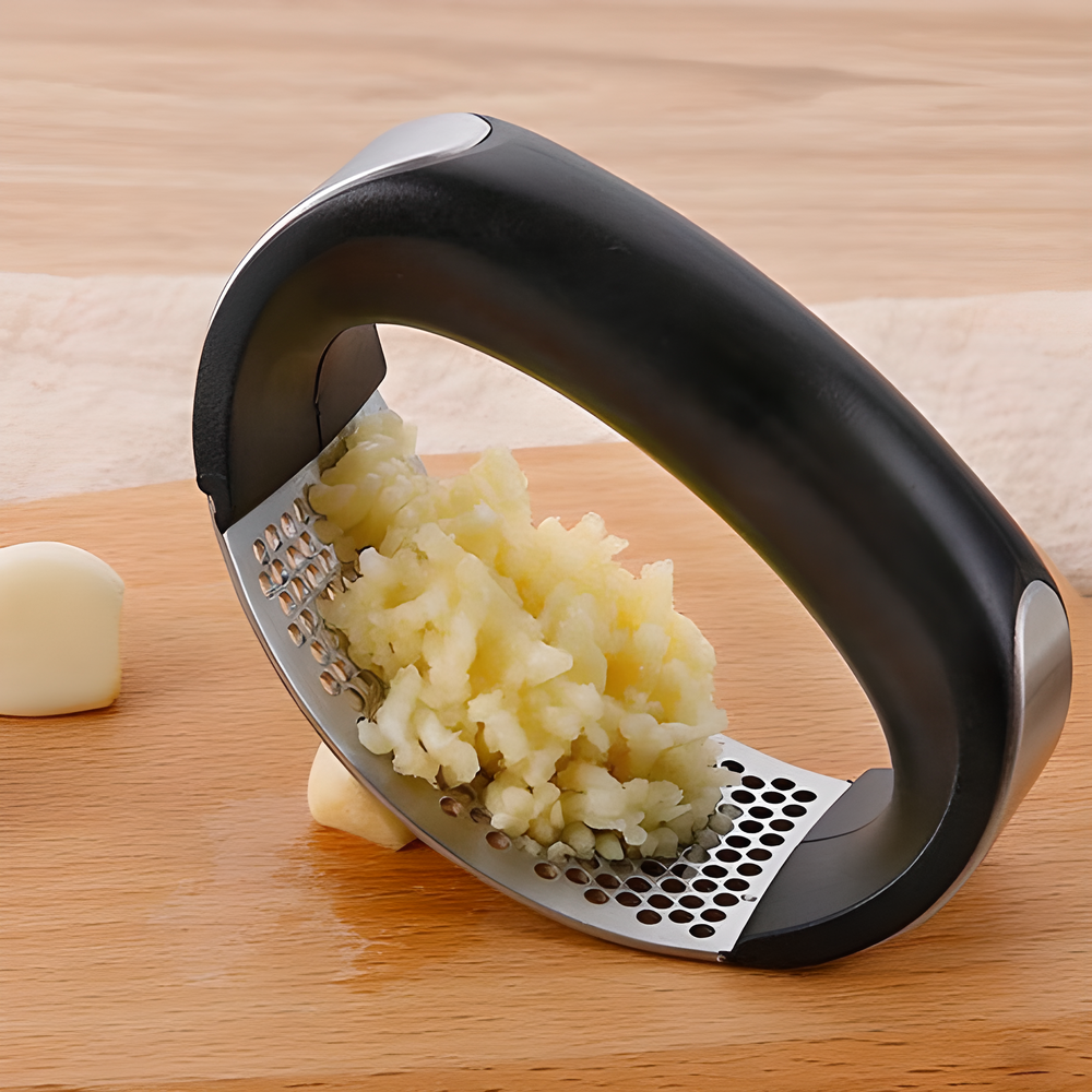 Stainless steel garlic mincer with ergonomic rocking design for quick and easy garlic preparation